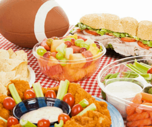 Food laid out on a table for a Super Bowl party