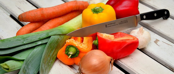 Vegetables on a cutting board with knife